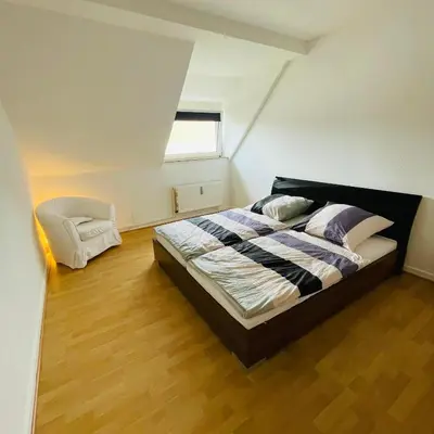 Ein Bett oder Betten in einem Zimmer der Unterkunft Nette Kuschelige Wohnung 2