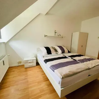 Ein Bett oder Betten in einem Zimmer der Unterkunft Nette Kuschelige Wohnung 2