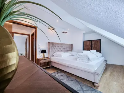 Ein Bett oder Betten in einem Zimmer der Unterkunft Alpha Apartments