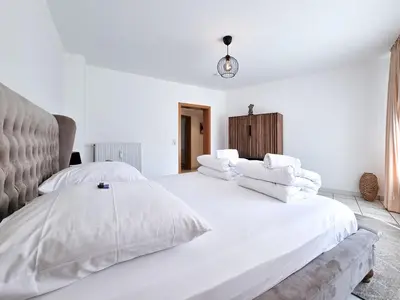 Ein Bett oder Betten in einem Zimmer der Unterkunft Alpha Apartments