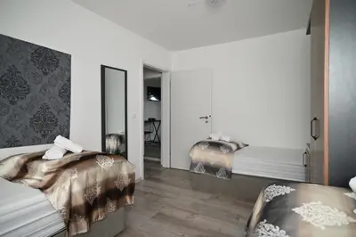 Ein Bett oder Betten in einem Zimmer der Unterkunft Ferienwohnung&Aparts By kispet group hotels in Oberhausen