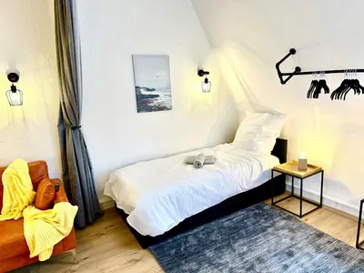 Ein Bett oder Betten in einem Zimmer der Unterkunft Stylish im Altbau, Netflix, Sonos, nahe 3M und Vorwerk