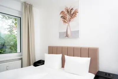 Ein Bett oder Betten in einem Zimmer der Unterkunft SHIN APARTMENTS