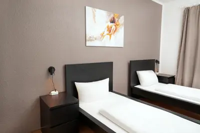 Ein Bett oder Betten in einem Zimmer der Unterkunft SHIN APARTMENTS