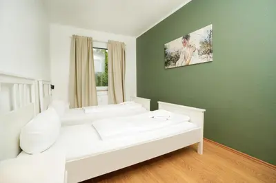 Ein Bett oder Betten in einem Zimmer der Unterkunft SHIN APARTMENTS