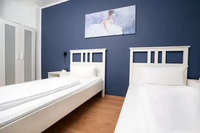 Ein Bett oder Betten in einem Zimmer der Unterkunft SHIN APARTMENTS