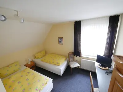 Ein Bett oder Betten in einem Zimmer der Unterkunft TM Hotel Westfalen