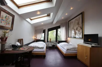 Ein Bett oder Betten in einem Zimmer der Unterkunft Air Boardinghouse Tulip Stockum, zu Fuß - 3 Minuten zur Messe