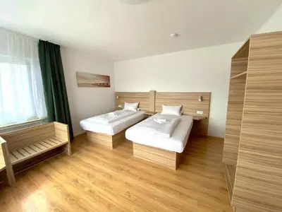Ein Bett oder Betten in einem Zimmer der Unterkunft Limok Rooms Hamm