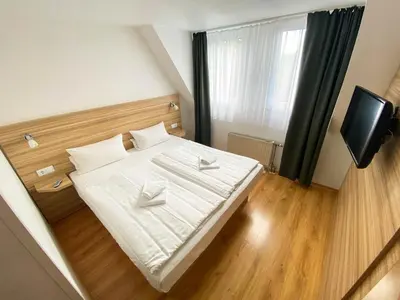 Ein Bett oder Betten in einem Zimmer der Unterkunft Limok Rooms Hamm