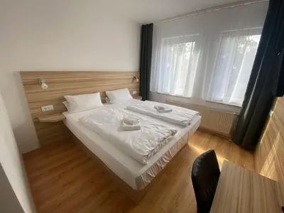 Ein Bett oder Betten in einem Zimmer der Unterkunft Limok Rooms Hamm