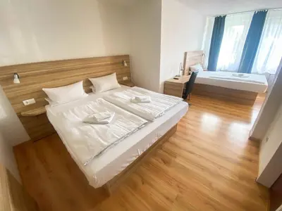 Ein Bett oder Betten in einem Zimmer der Unterkunft Limok Rooms Hamm