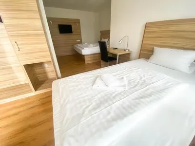Ein Bett oder Betten in einem Zimmer der Unterkunft Limok Rooms Hamm