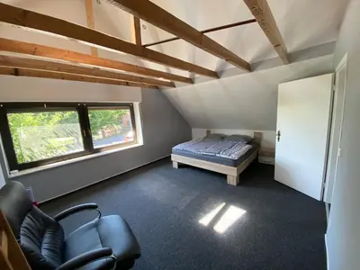 Ein Bett oder Betten in einem Zimmer der Unterkunft Ferienvilla Whirlpool Fasssauna direkt am Rhein