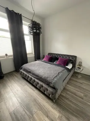 Ein Bett oder Betten in einem Zimmer der Unterkunft Ferienapartment Essen