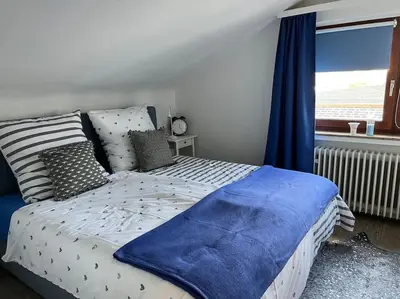 Ein Bett oder Betten in einem Zimmer der Unterkunft Gemütliches Apartment für Messe, Job & Kurzurlaub im Grünen, Nähe Düsseldorf