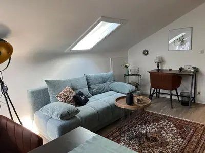 Ein Sitzbereich in der Unterkunft Gemütliches Apartment für Messe, Job & Kurzurlaub im Grünen, Nähe Düsseldorf