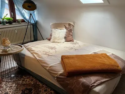 Ein Bett oder Betten in einem Zimmer der Unterkunft Gemütliches Apartment für Messe, Job & Kurzurlaub im Grünen, Nähe Düsseldorf