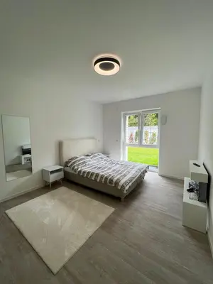Ein Bett oder Betten in einem Zimmer der Unterkunft Luxuriöses Apartment für 4 Personen, Neubau, Parkplatz free