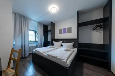 Ein Bett oder Betten in einem Zimmer der Unterkunft Hotel Central