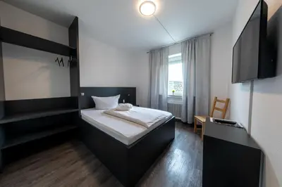 Ein Bett oder Betten in einem Zimmer der Unterkunft Hotel Central