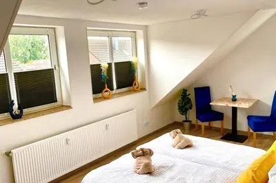 Ein Bett oder Betten in einem Zimmer der Unterkunft Zuhause im Ruhrgebiet 3 mit Balkon