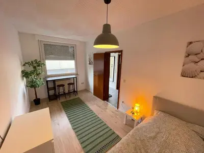 Ein Bett oder Betten in einem Zimmer der Unterkunft Cozy Apartment in Oberhausen
