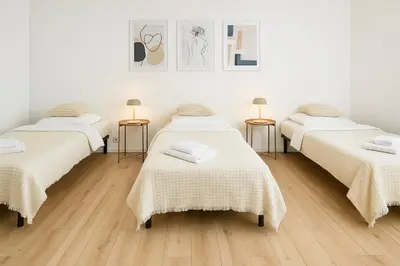 Ein Bett oder Betten in einem Zimmer der Unterkunft Airport Messe Apartments