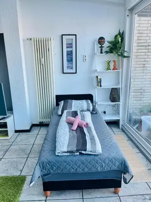 Ein Bett oder Betten in einem Zimmer der Unterkunft NaSa Wohnung Uerdingen