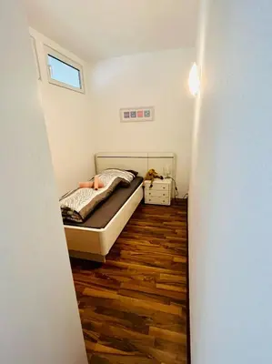 Ein Bett oder Betten in einem Zimmer der Unterkunft NaSa Wohnung Uerdingen