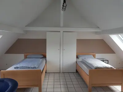 Ein Bett oder Betten in einem Zimmer der Unterkunft Gemütliche Zimmer - Messe Gruga