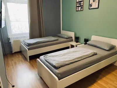 Ein Bett oder Betten in einem Zimmer der Unterkunft Gemütliche Zimmer - Messe Gruga