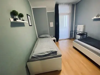 Ein Bett oder Betten in einem Zimmer der Unterkunft Gemütliche Zimmer - Messe Gruga