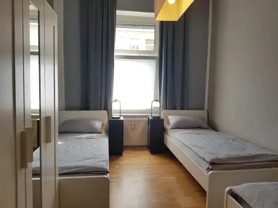 Ein Bett oder Betten in einem Zimmer der Unterkunft Gemütliche Zimmer - Messe Gruga