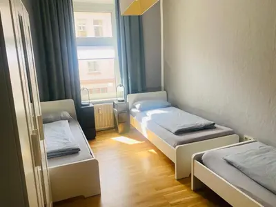 Ein Bett oder Betten in einem Zimmer der Unterkunft Gemütliche Zimmer - Messe Gruga