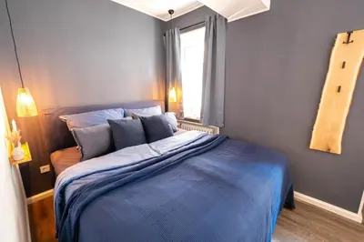 Ein Bett oder Betten in einem Zimmer der Unterkunft TANIC Deluxe Apartment Garden Central Industrial Fair