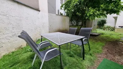 Ein Garten an der Unterkunft TANIC Deluxe Apartment Garden Central Industrial Fair