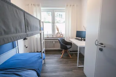 Ein Bett oder Betten in einem Zimmer der Unterkunft TANIC Deluxe Apartment Garden Central Industrial Fair