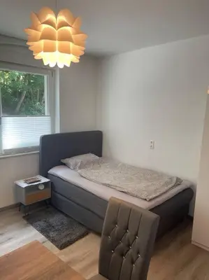 Ein Bett oder Betten in einem Zimmer der Unterkunft Großzügige Wohnung
