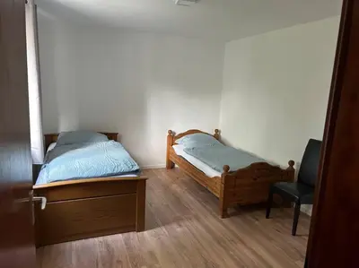 Ein Bett oder Betten in einem Zimmer der Unterkunft Moderne Service Apartment AVD3