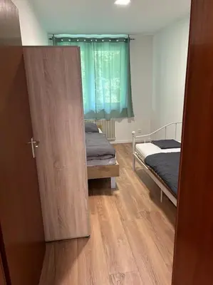 Ein Bett oder Betten in einem Zimmer der Unterkunft Moderne Service Apartment AVD3