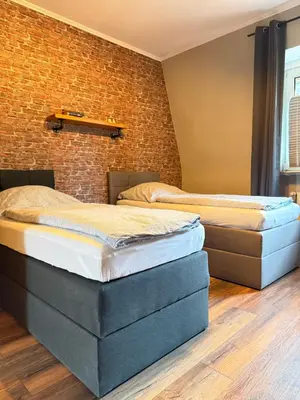 Ein Bett oder Betten in einem Zimmer der Unterkunft Industrial Style 77qm mit Balkon
