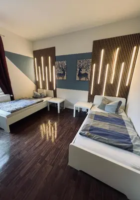 Ein Bett oder Betten in einem Zimmer der Unterkunft Comfort Apartments - Sky Bundesliga, PlayStation, Grill & Balkon - Haus Burgstadt