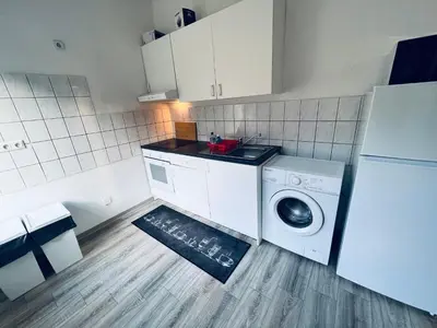 Küche/Küchenzeile in der Unterkunft Comfort Apartments - Sky Bundesliga, PlayStation, Grill & Balkon - Haus Burgstadt