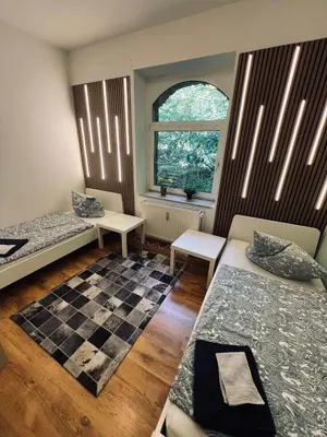 Ein Bett oder Betten in einem Zimmer der Unterkunft Comfort Apartments - Sky Bundesliga, PlayStation, Grill & Balkon - Haus Burgstadt