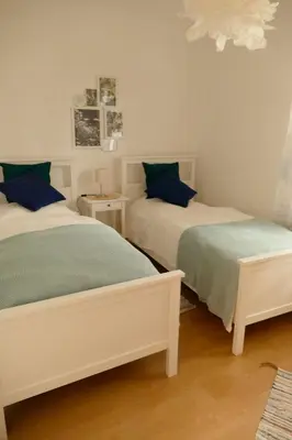 Ein Bett oder Betten in einem Zimmer der Unterkunft Ferienwohnung Wengerner Mühle