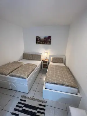Ein Bett oder Betten in einem Zimmer der Unterkunft Alex Apartments