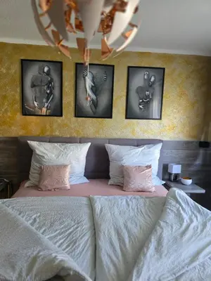 Ein Bett oder Betten in einem Zimmer der Unterkunft schlafgut24