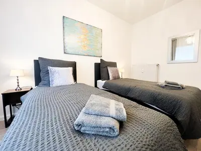 Ein Bett oder Betten in einem Zimmer der Unterkunft Apartment Düsseldorf City
