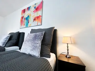 Ein Bett oder Betten in einem Zimmer der Unterkunft Apartment Düsseldorf City